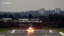 Planes battle against crosswinds from Storm Brendan as they land at Birmingham Airport