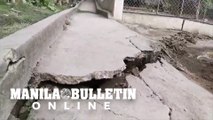 A portion of a road in Barangay Sinisian East was damaged by constant earthquakes