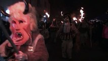 Bulgarian villagers chase away evil with scary masks, furry costumes