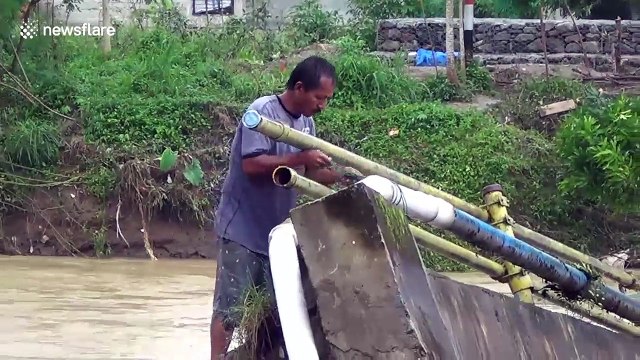 Flash floods in Indonesia leave thousands under threat from clean water crisis