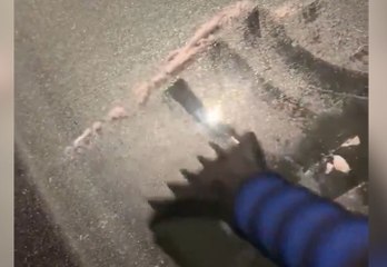 Freezing drizzle leaves car with a glaze of ice