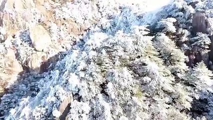 Drone footage shows stunning sea of clouds and ice formations on China's Mount Jiuhua