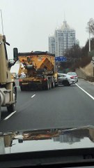 Truck Pushes Car Onto Freeway Shoulder
