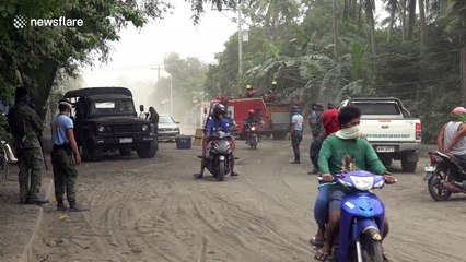 Roads in the Philippines covered in ash after Taal volcano eruption