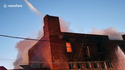 Pennsylvania firefighters attack burning factory in frigid conditions