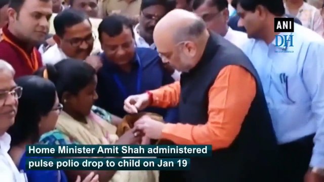 Amit Shah gives polio drops to child on Pulse Polio Day