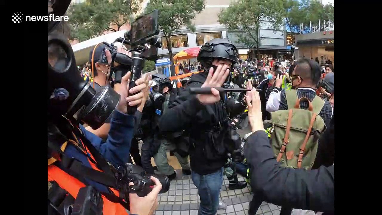 Scuffles break out between protesters and riot police in central Hong Kong