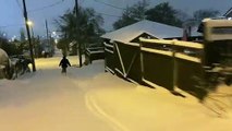 Heavy Snow Turns Streets Into Ski Slopes