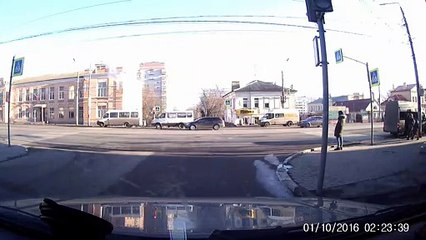 Colliding Cars Barely Miss Pedestrians