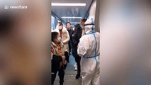 Hangzhou International Airport staff check tourists' temperatures amid coronavirus scare
