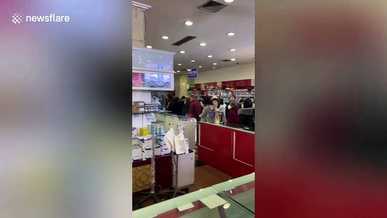 Shanghai residents queue in pharmacies to buy masks amid the spreading of a coronavirus in China