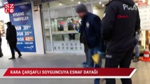 Kara çarşaf giyen soyguncuya esnaf dayağı