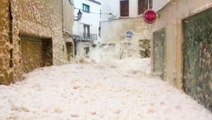 Storm Gloria floods city with foam