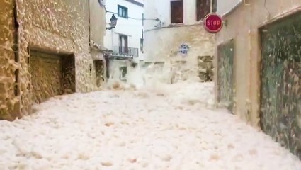 Storm Gloria floods city with foam