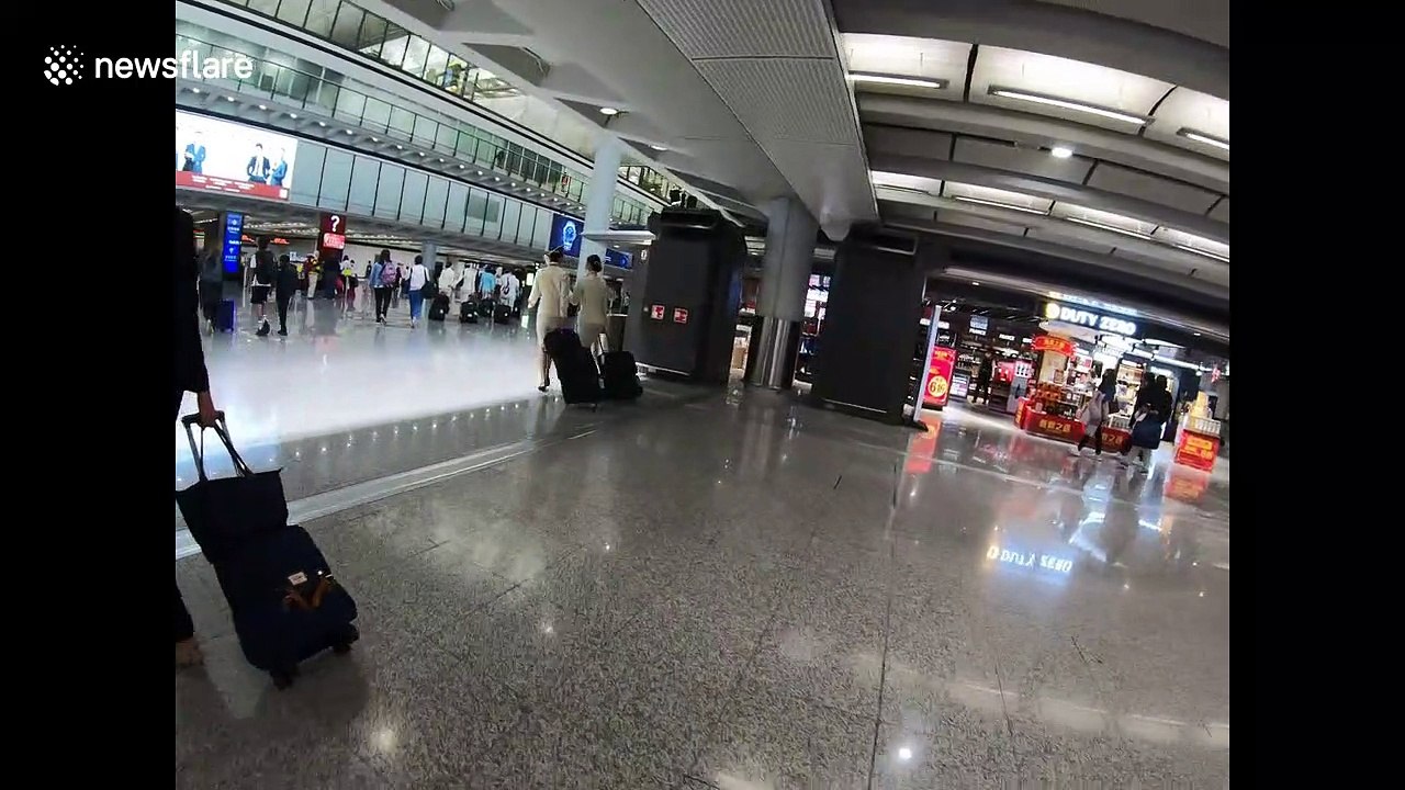Infrared thermal scanning displays the temperature of arriving travellers at Hong Kong International Airport as coronavirus spreads