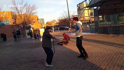 92-year-old grandpa engages in epic dance-off with Chicago street performer
