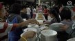 Volunteers serve hot meals to Taal Volcano evacuees