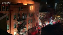 Historic New York City Chinatown building caught on fire while FDNY rescues a trapped resident