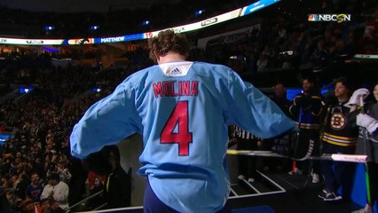 Matthew Tkachuk surprises the crowd with Yadier Molina jersey