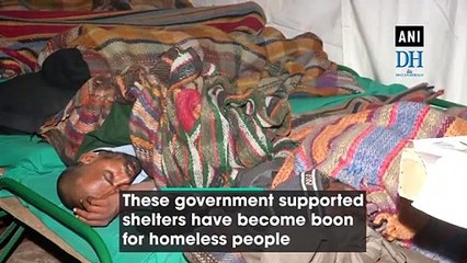 Homeless people take refuge at night shelter in Delhi’s Nizamuddin