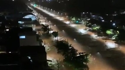 Torrential rains turned city streets into rapid rivers