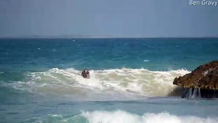 Surfer Makes a Tight Squeeze