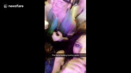 Strange man dances with garlic at Chicago music fest