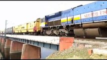 Indian villagers sprint across active railway bridge ahead of trains