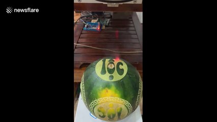 Vietnamese shop uses laser technology to decorate watermelon for Lunar New Year