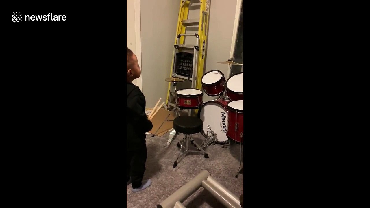 Music obsessed two-year-old has best reaction to brand new drum kit