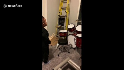 Music obsessed two-year-old has best reaction to brand new drum kit