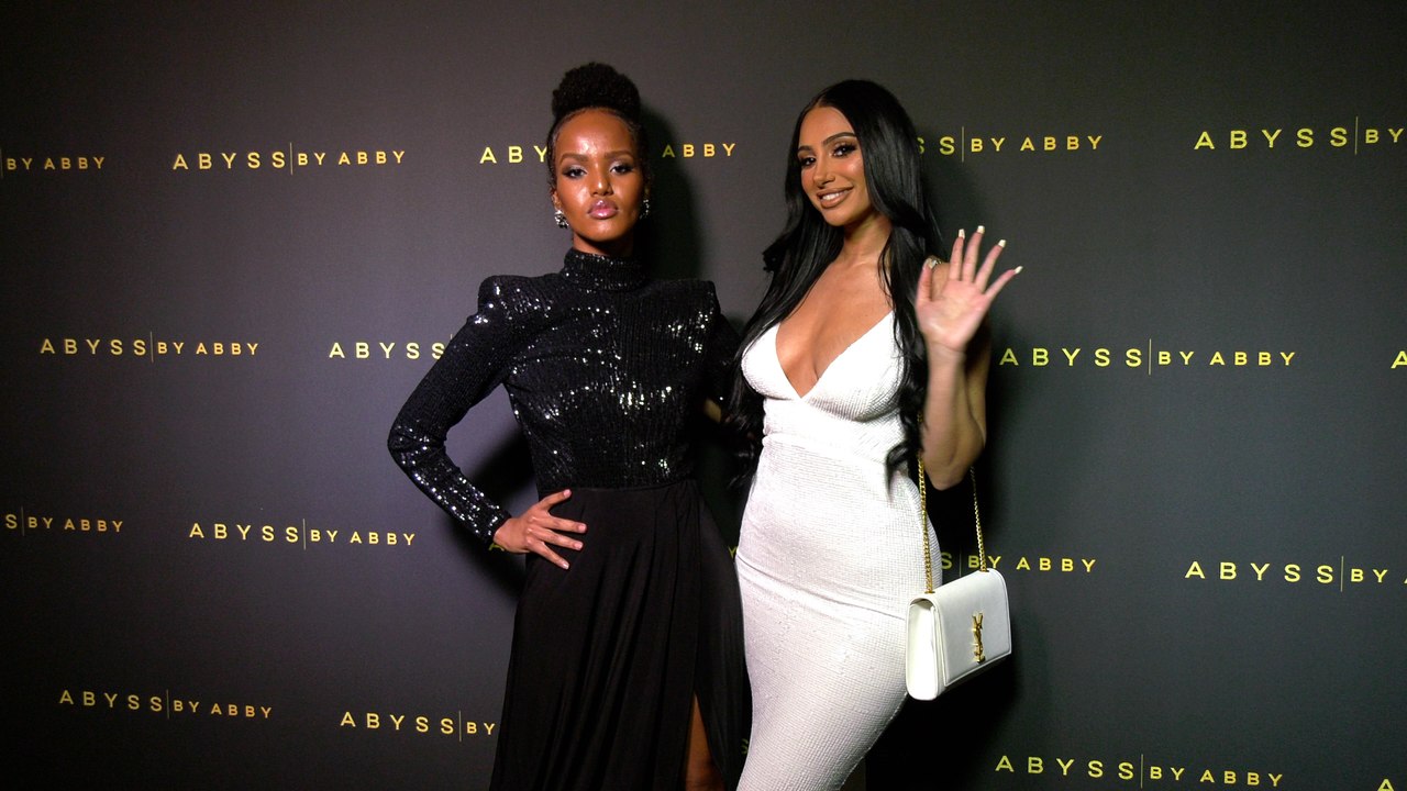 Dahabo Hagi, Natalie Riany "Abyss by Abby’s Goddess Within Collection Launch" Black Carpet