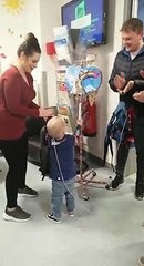 Joseph Archer rings the bell in hospital to mark the end of treatment