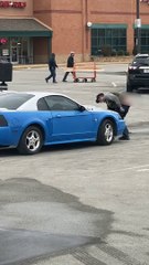 Guy With Sagging Pants Paints His Ride in Parking Lot