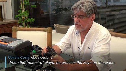 Special gloves help Brazilian musician return piano playing