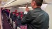 Passengers applaud after their Shanghai flight was rerouted to Wuhan sending residents back home during coronavirus outbreak
