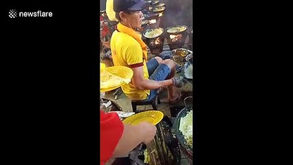 Three chefs use 36 pans to make crepes for thousands of visitors celebrating Lunar New Year in southern Vietnam