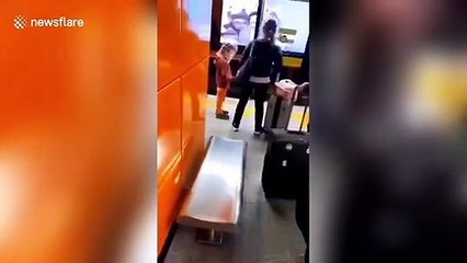 Скачать видео: Commuters wear plastic bottles on heads at Chinese train station amid coronavirus outbreak