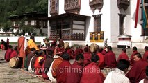 Monks performing rituals accompained by traditional music in Bumthang, Bhutan