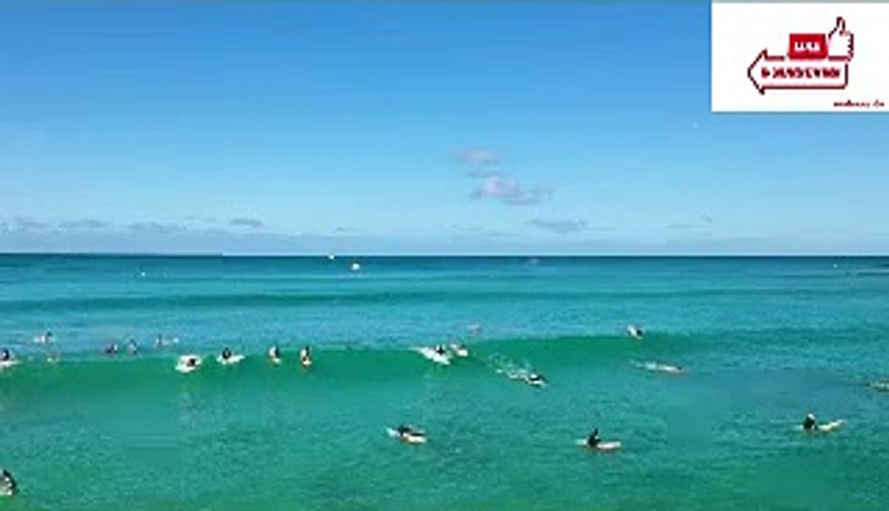 People Surfing on Sea Waves