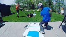 Puck Crosses Over Lawnmower While Dad Cuts Grass After Kid Shoots Fantastic Hockey Trickshot