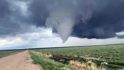 Storm Chaser Walks Towards Tornado
