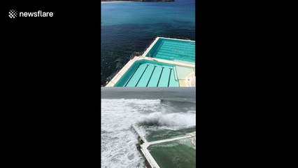 Waves crash into Bondi Beach's famous Iceberg Club as storm hits Sydney