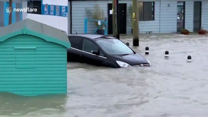 Cars float away during heavy flooding in Essex