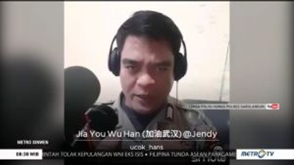Seorang Anggota Polri Ekspresikan Dukungan Moral untuk Wuhan Lewat Lagu