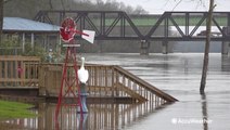 Alabama backyards, pavillions sinking into floodwaters