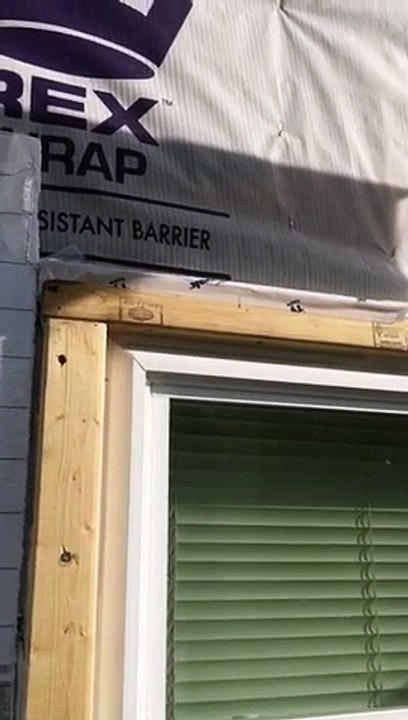 Proper Preparation for a Door  before Siding Installation  Passaic County NJ house installation of tyvek insulation and tape around door and seems to keep drafts out