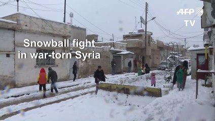 Snow blankets Qamishli in war-torn Syria, rejoicing its residents