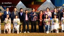 Couples get married in hot air balloons for Valentine's Day in Thailand