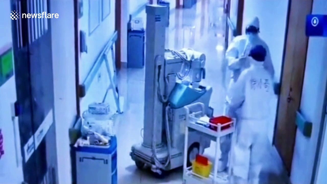 Chinese couple fighting coronavirus hug after not seeing each other for five days